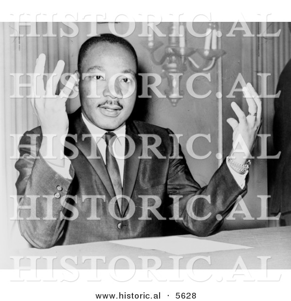 Historical Photo of Martin Luther King Jr. Sitting Behind a Desk - Black and White Version