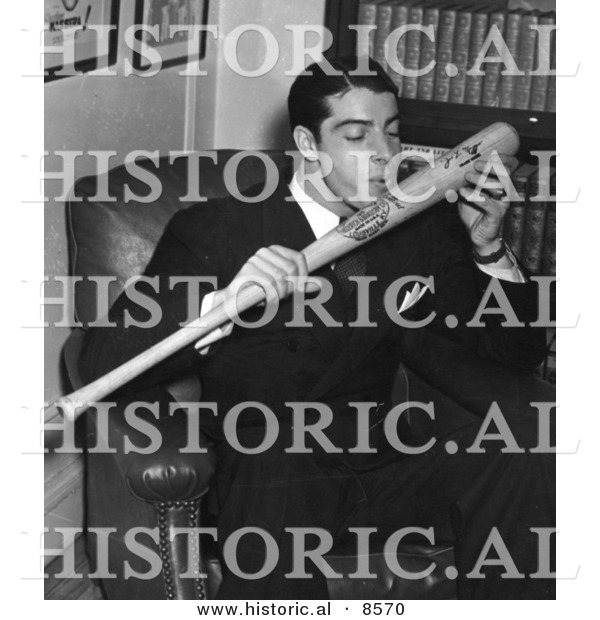Historical Photo of New York Yankees Baseball Player, Joe Dimaggio, Kissing His Signature on a Baseball Bat, 1941 - Black and White Version
