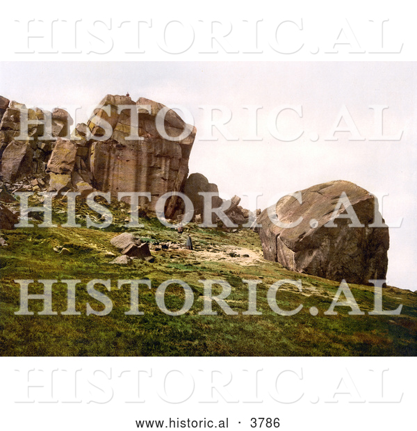 Historical Photochrom of a Man Looking down from the Cliff over Two People at Cow and Calf Rocks in Ilkley West Yorkshire England UK