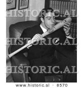 Historical Photo of New York Yankees Baseball Player, Joe Dimaggio, Kissing His Signature on a Baseball Bat, 1941 - Black and White Version by Al