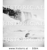 Historical Photo of People Walking Through Snow Towards an Icy Mountain near Niagara Falls in Winter - Black and White Version by Al