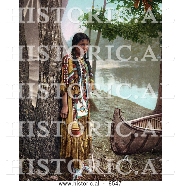 Historical Photo of Young Native American Indian Girl Posing Against a Tree Beside a Boat on a River Bank 1904
